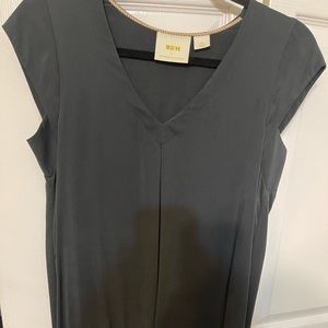 black top  cut outs in back , very soft silk. Great top to dress up or down.